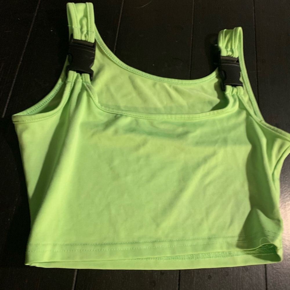 Woman’s lime green cropped top with black buckles